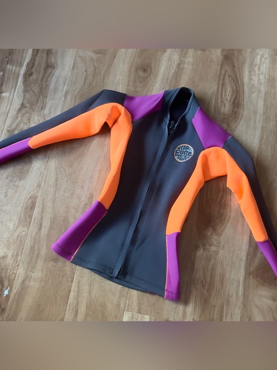 Rip Curl Other - Women’s size S rip curl long sleeve jacket Rashguard - Black, Orange & Purple